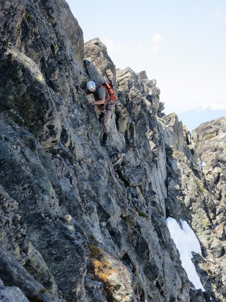 Traversing_4th_class_to_base_of_the_West_Ridge_of_Forbidden.JPG