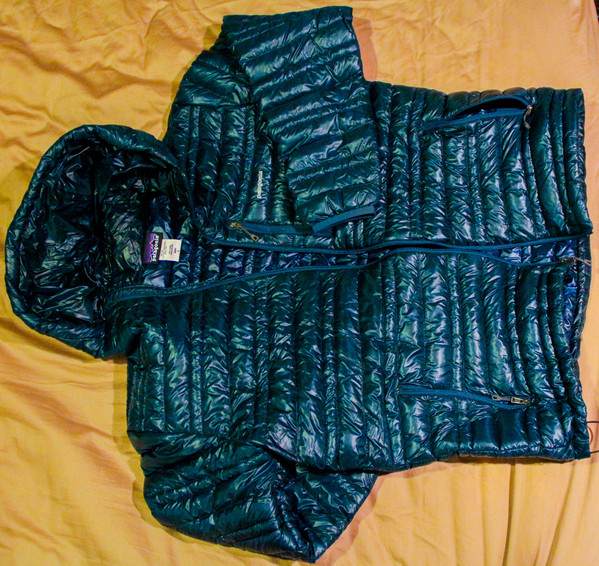 tags Patagonia ultralight down hoodie. $215 includes shipping to the lower 48 states. The color is dark Blue (midnight) and the size is large